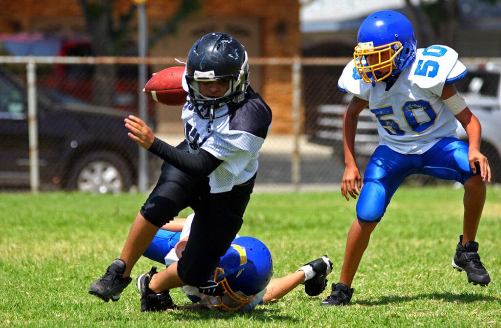 Youth playing football