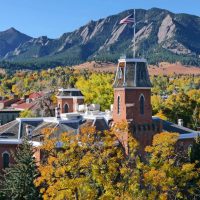CU - Old Main with Flatirons in background