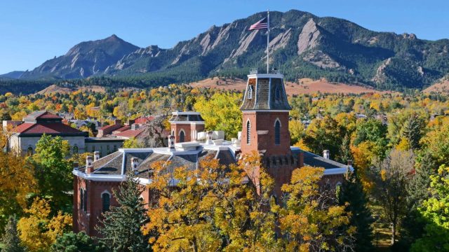 CU - Old Main with Flatirons in background